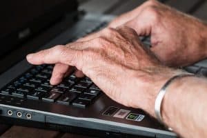 seniors typing keyboard